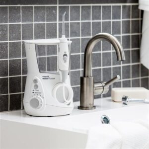 White Aquarius Water Flosser WP 660 in Bathroom
